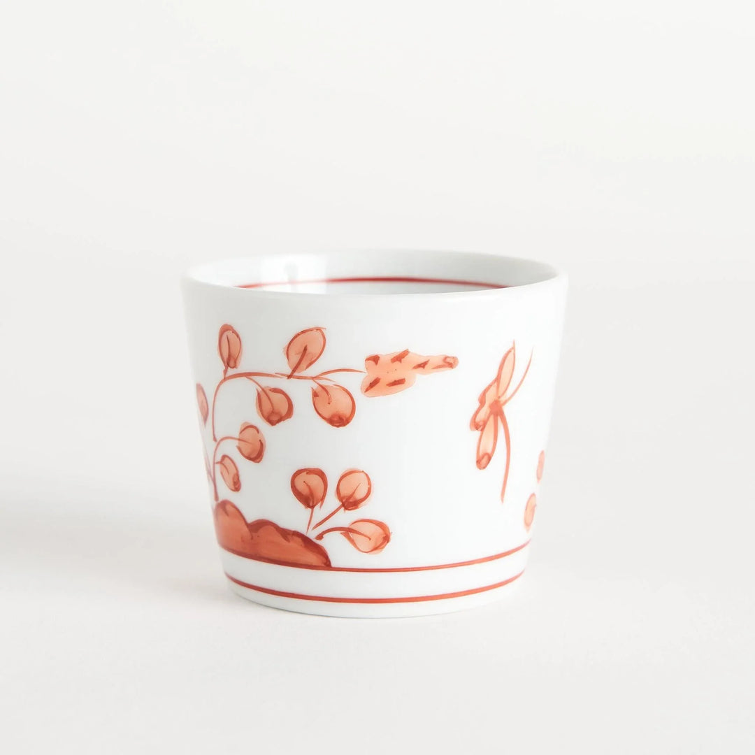 A white condiment bowl decorated with blue bush clover patterns around the side, ideal for small servings or sauces.