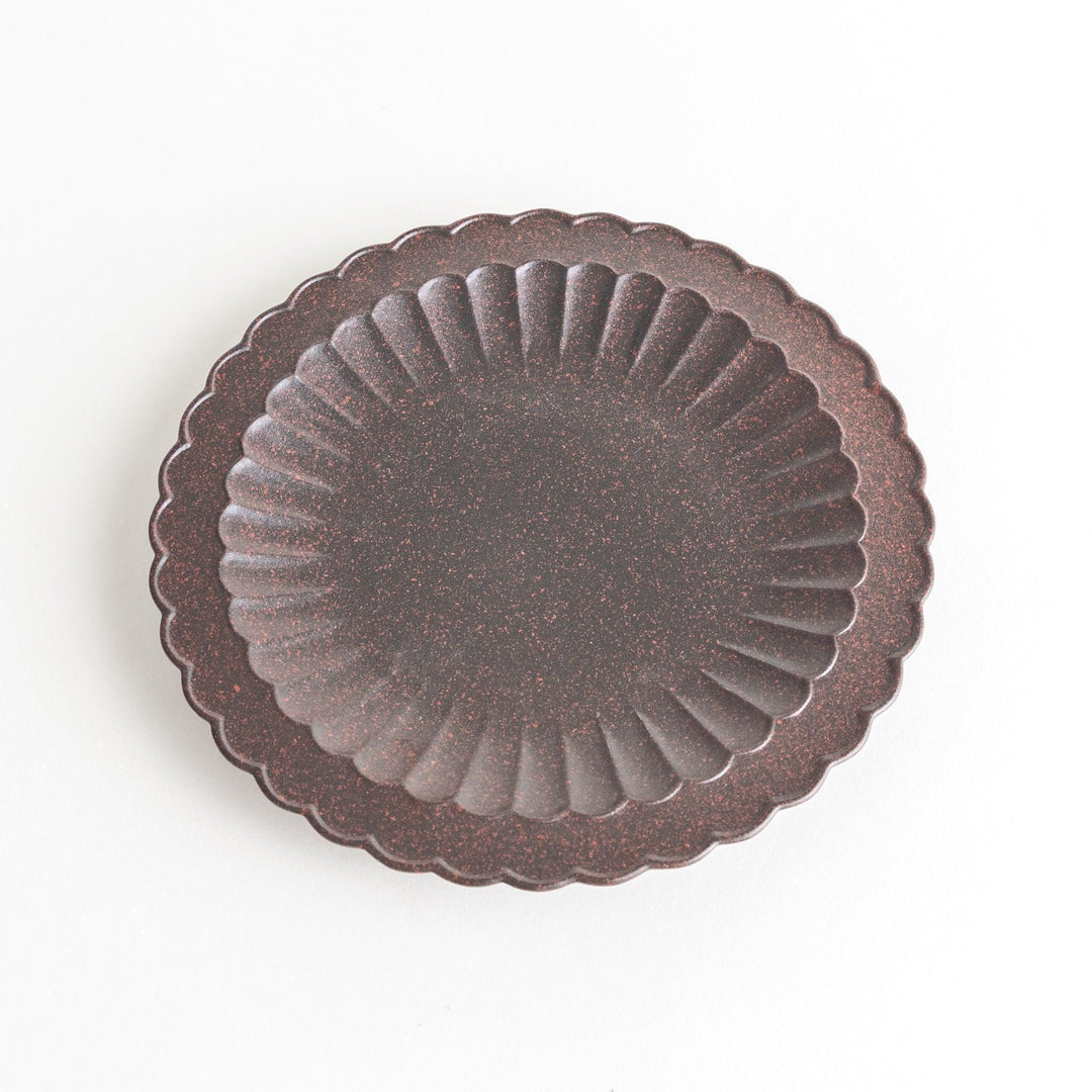 Fluted ceramic salad plate in matte black and light blue.