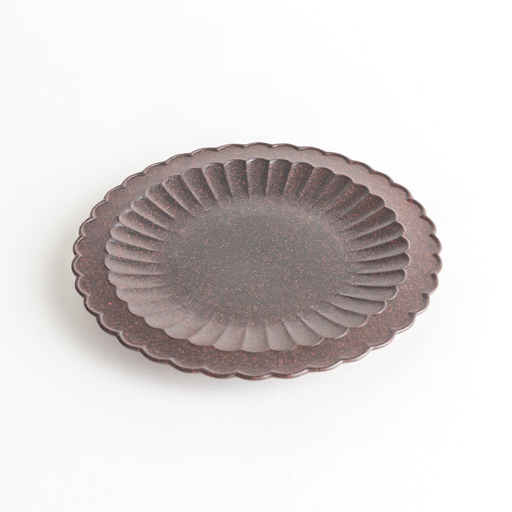 Fluted ceramic salad plate in matte black and light blue.