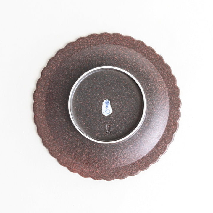 Fluted ceramic salad plate in matte black and light blue.