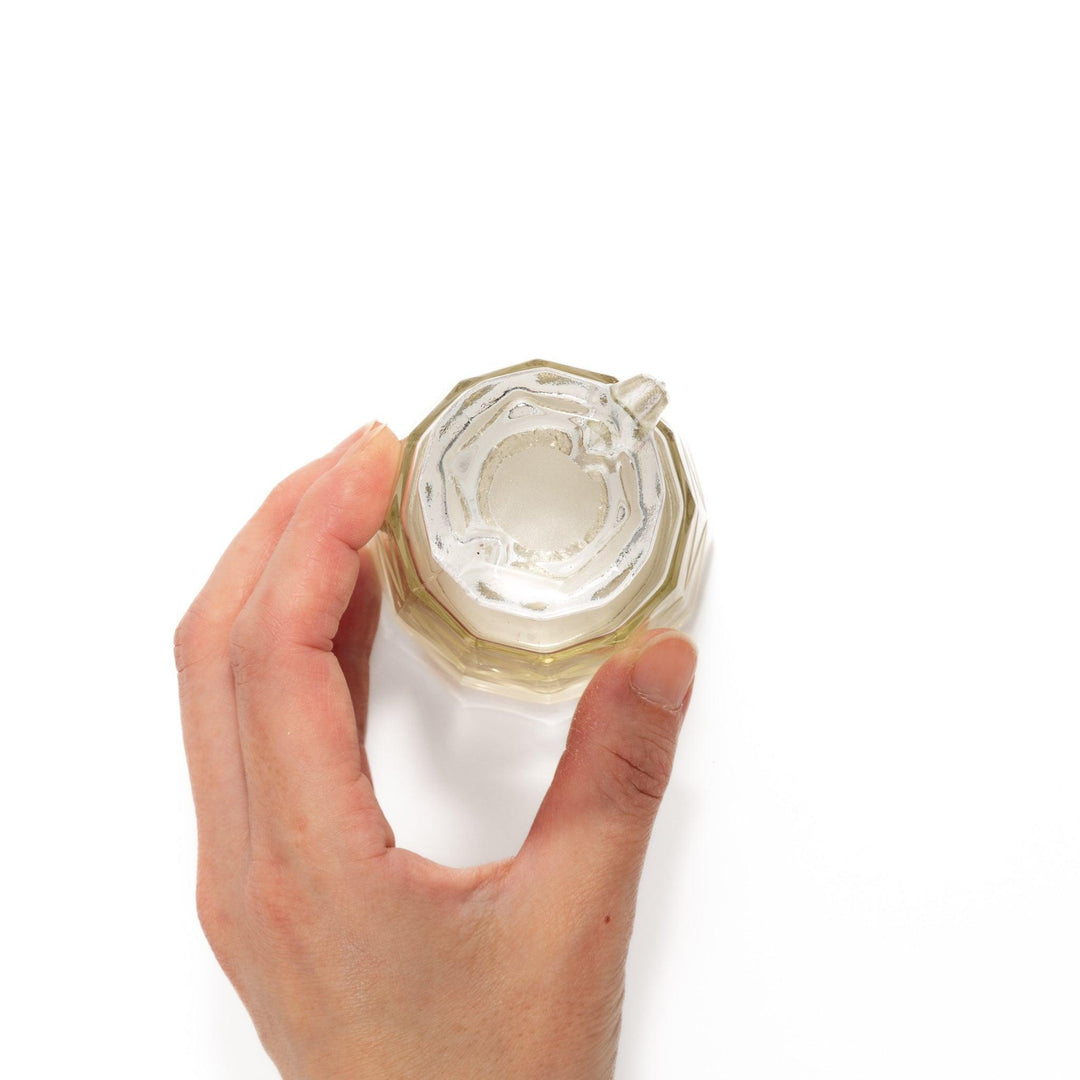 Elegant soy sauce dispenser with a celestial star-patterned design and smooth pour spout.