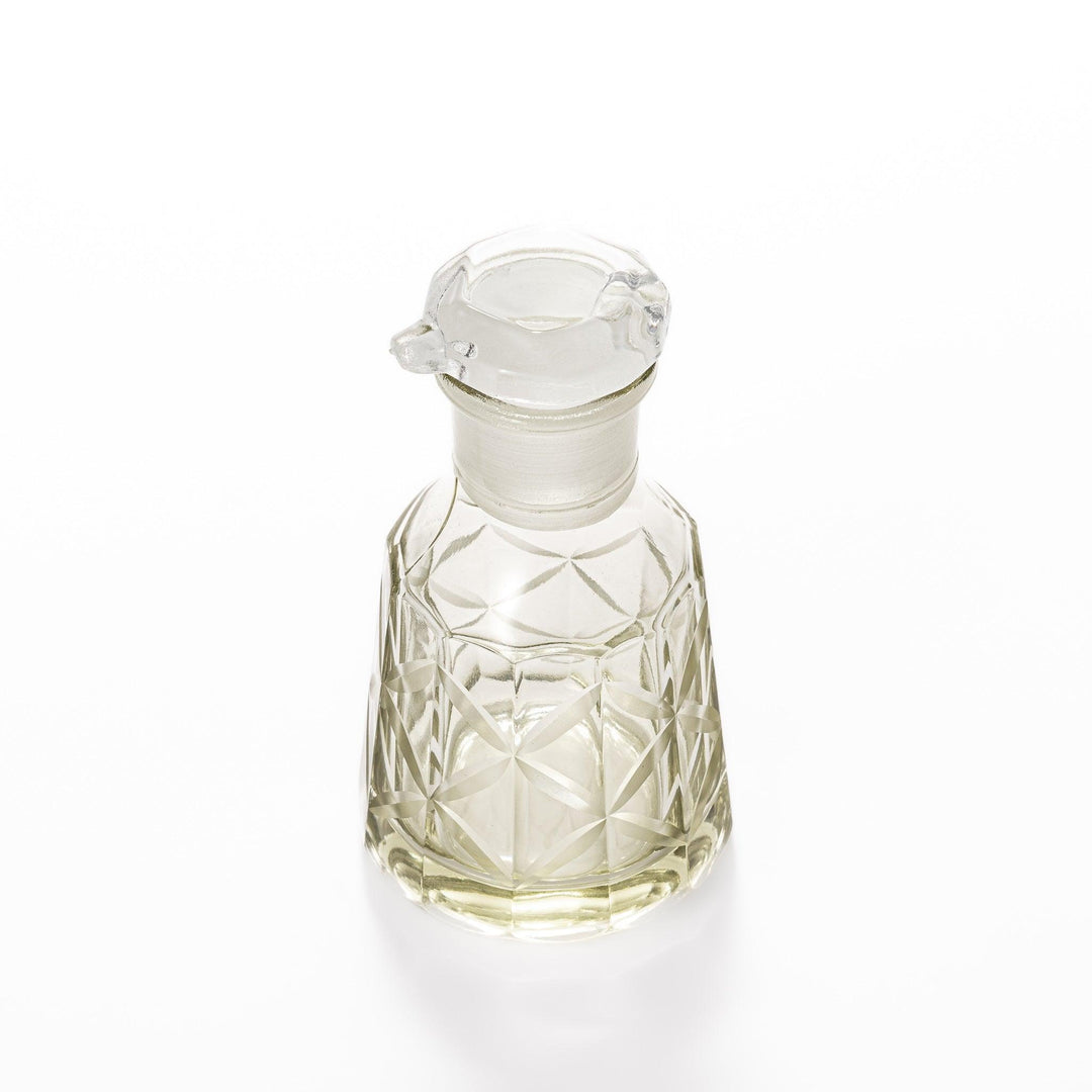 Elegant soy sauce dispenser with a celestial star-patterned design and smooth pour spout.