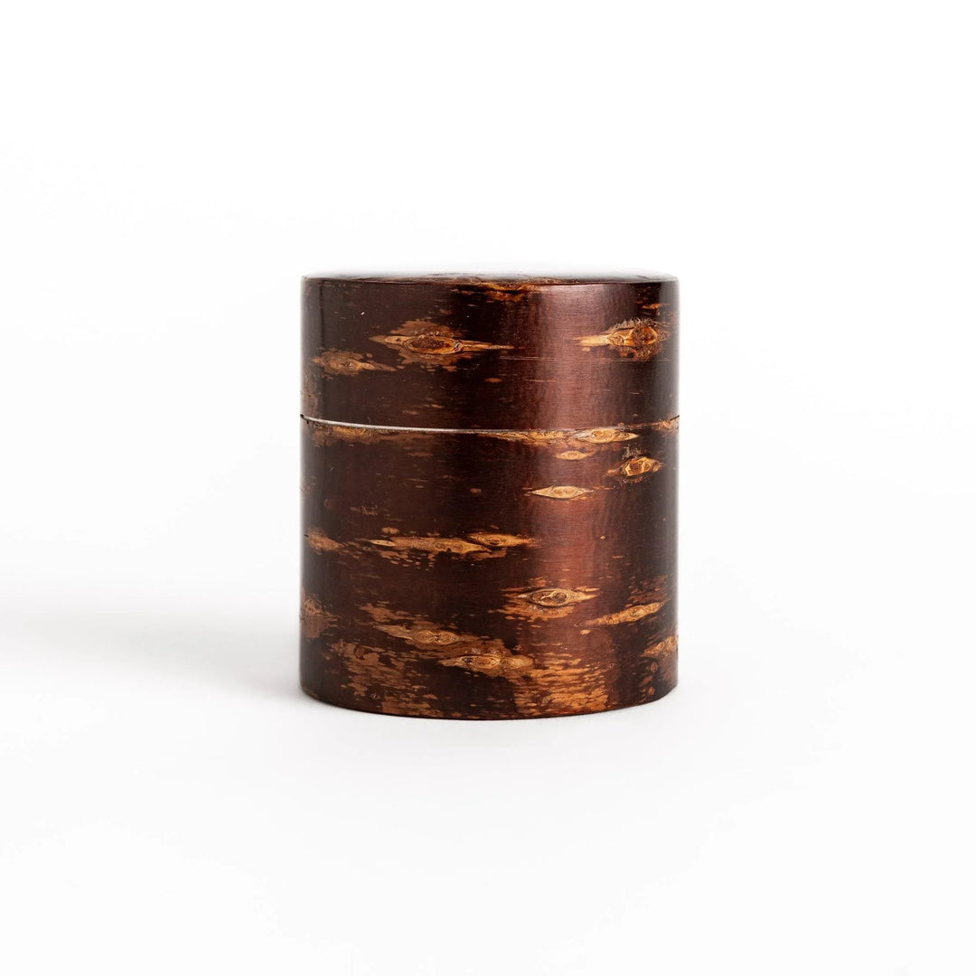 Cherry bark tea canister with rich dark brown finish and visible grain for preserving loose leaf tea.