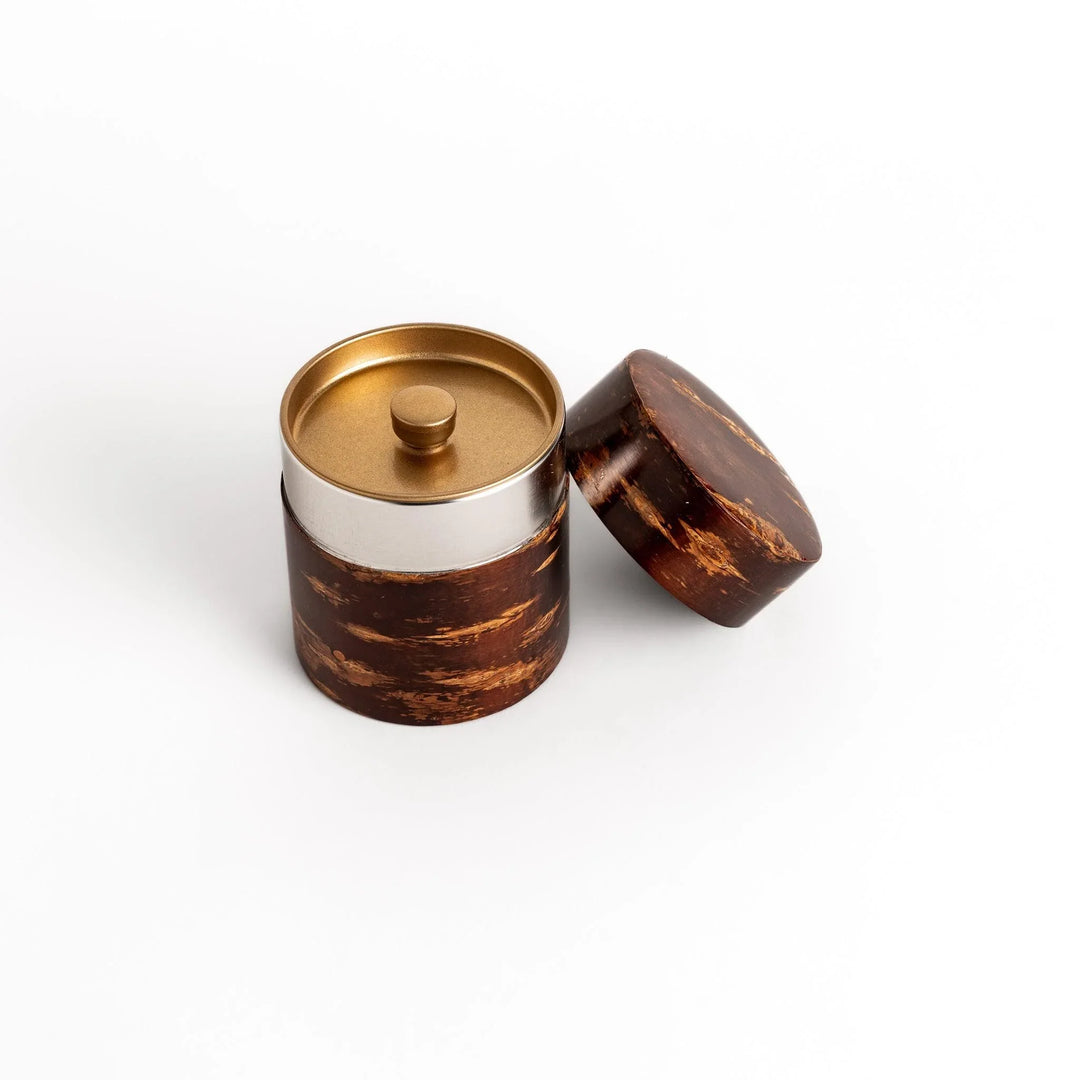 Cherry bark tea canister with rich dark brown finish and visible grain for preserving loose leaf tea.
