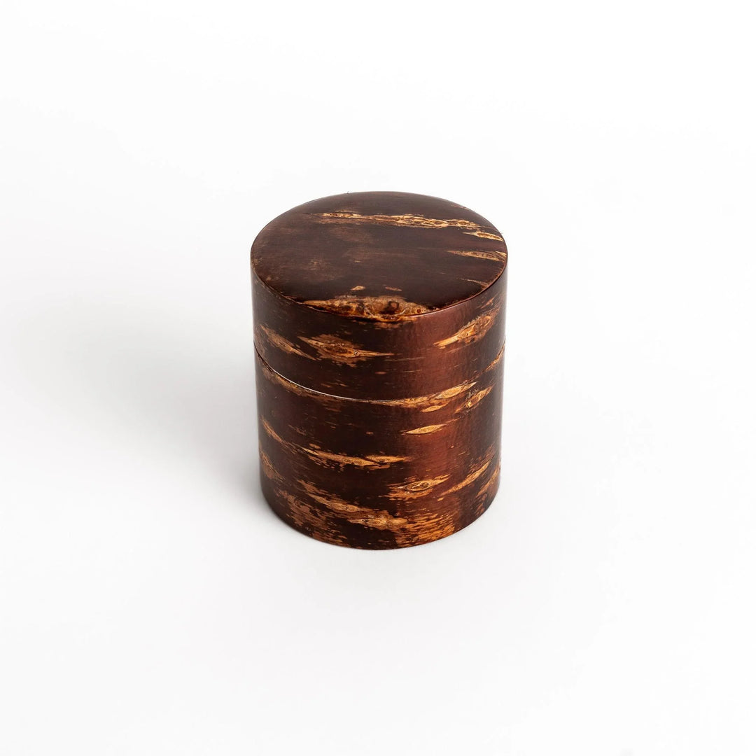 Cherry bark tea canister with rich dark brown finish and visible grain for preserving loose leaf tea.