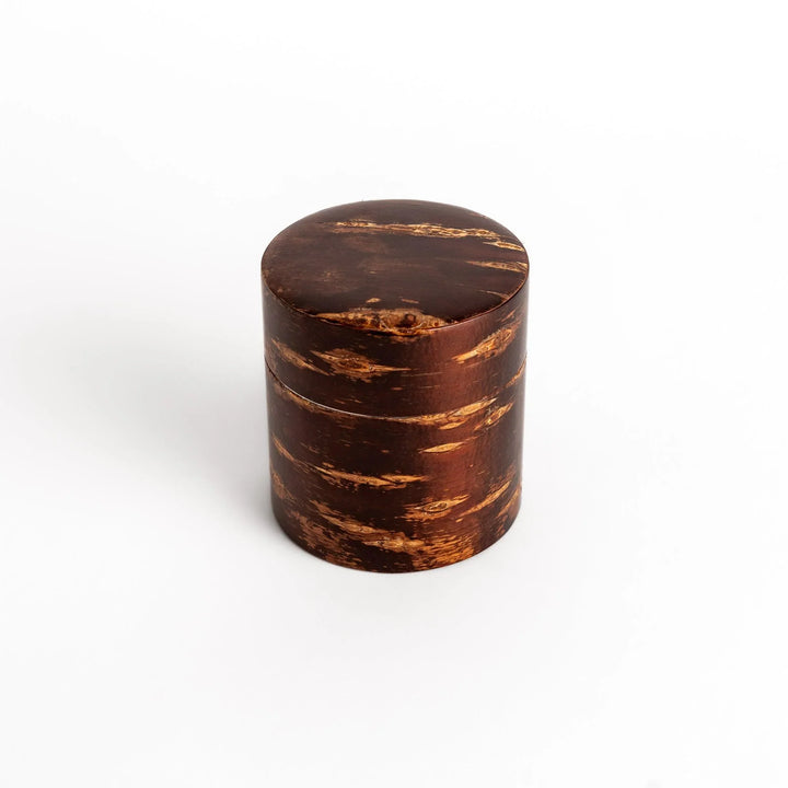 Cherry bark tea canister with rich dark brown finish and visible grain for preserving loose leaf tea.