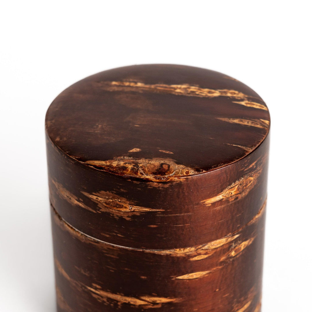 Cherry bark tea canister with rich dark brown finish and visible grain for preserving loose leaf tea.