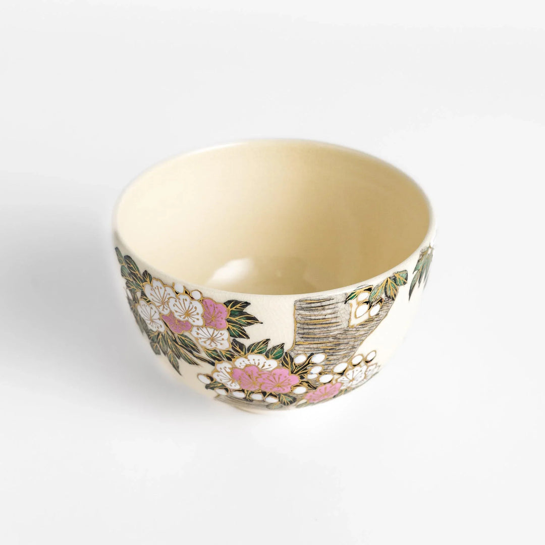 Cherry Blossom Matcha Bowl with delicate floral motifs and gold details, ideal for elegant and serene tea enjoyment.
