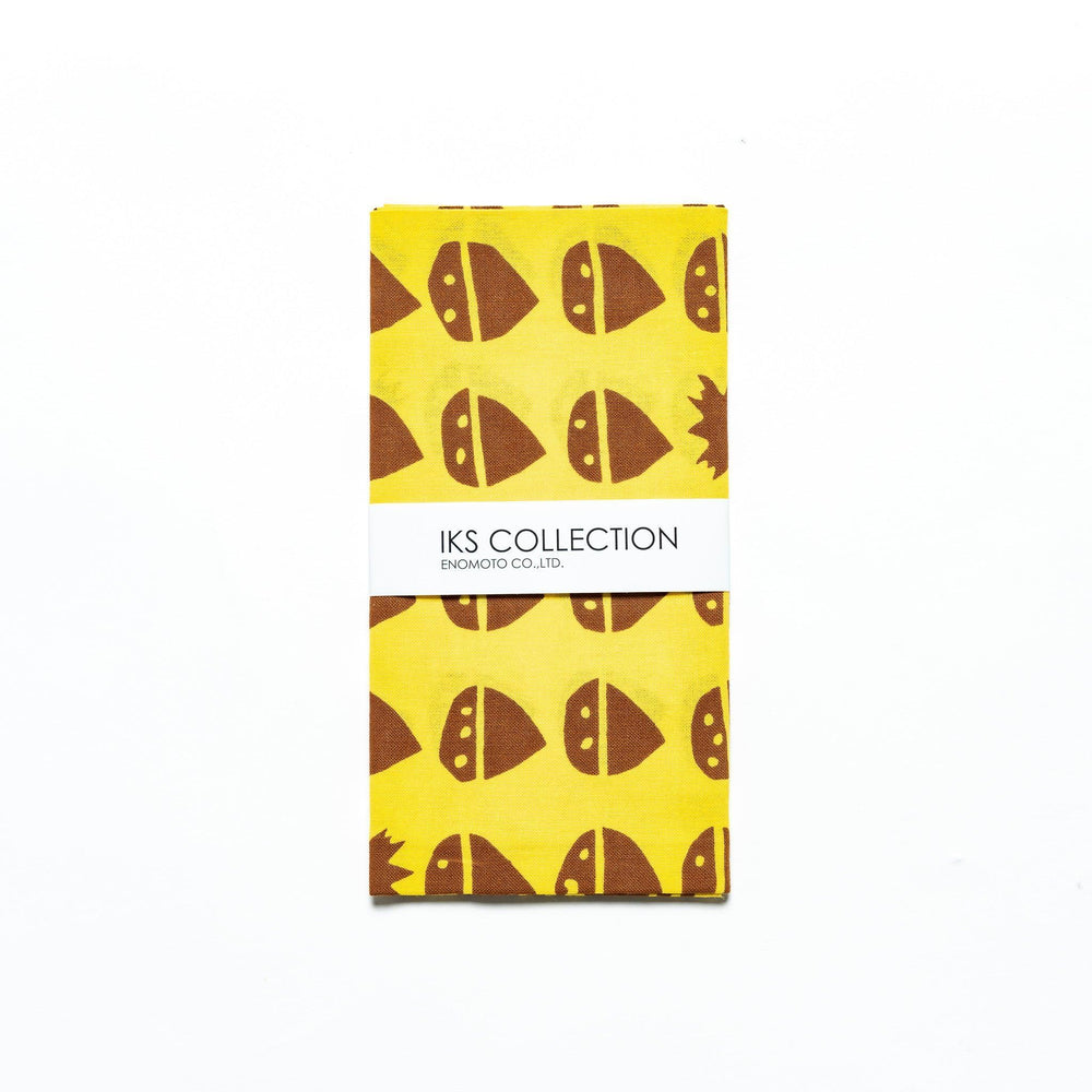 Folded yellow tenugui with chestnut motifs, neatly presented with a product sleeve.