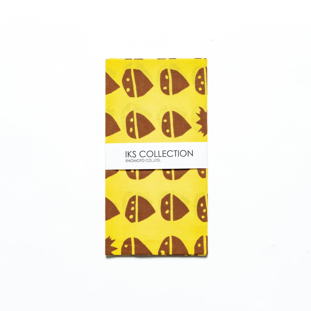Folded yellow tenugui with chestnut motifs, neatly presented with a product sleeve.