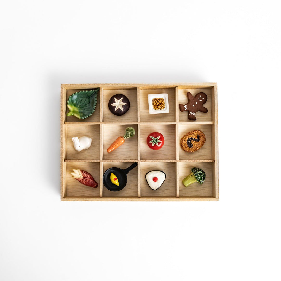 Wooden chopstick rest organizer with 12 sections, ideal for storing and displaying various chopstick rests.