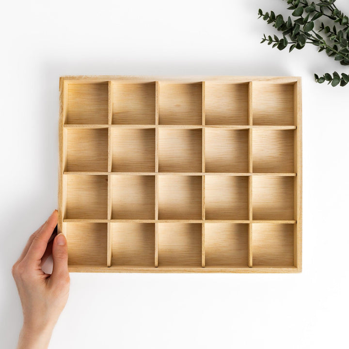A wooden organizer designed to hold 20 charming chopstick rests, keeping them neatly arranged and easily accessible.