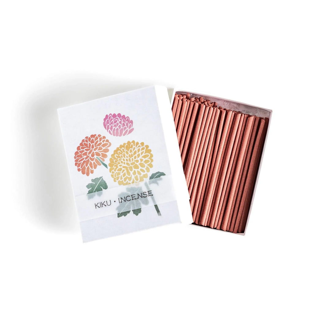Incense with brown sticks in a chrysanthemum box, offering a refined floral aroma for a calm setting.