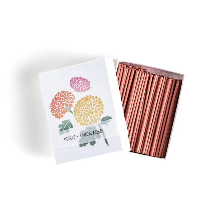 Incense with brown sticks in a chrysanthemum box, offering a refined floral aroma for a calm setting.