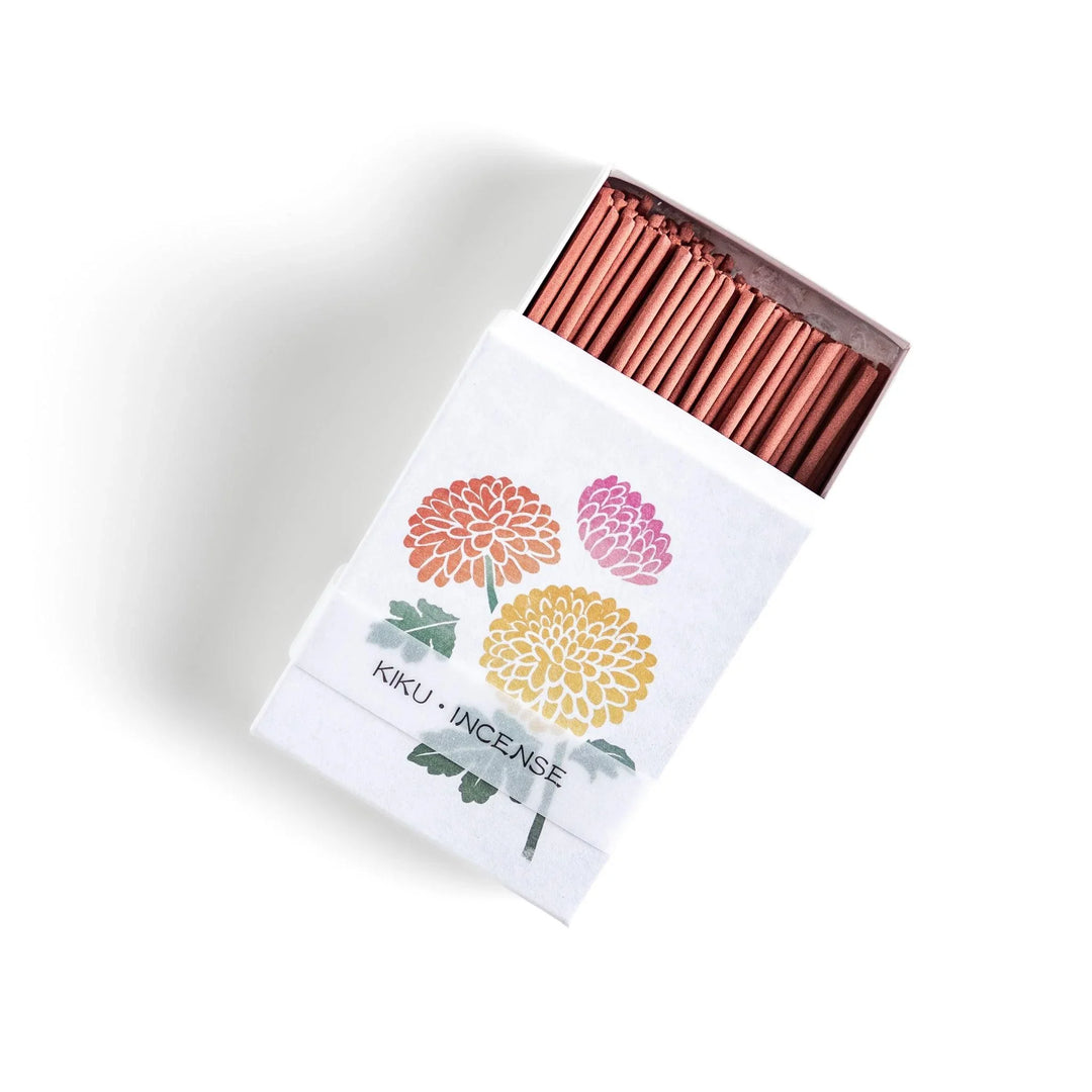 Incense with brown sticks in a chrysanthemum box, offering a refined floral aroma for a calm setting.