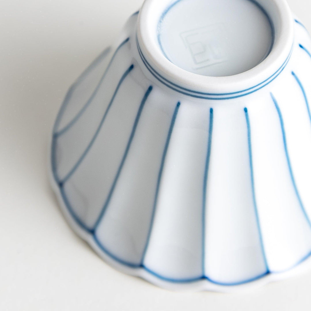 Small scalloped edge condiment bowls, one with blue stripes and the other with red stripes