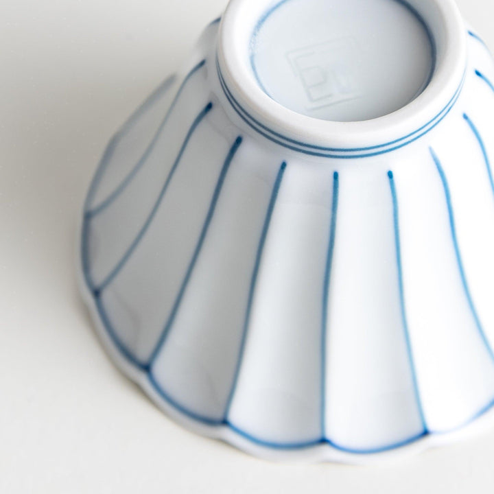 Small scalloped edge condiment bowls, one with blue stripes and the other with red stripes