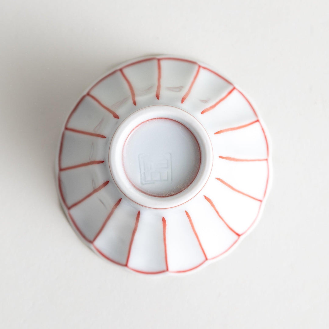 Small scalloped edge condiment bowls, one with blue stripes and the other with red stripes