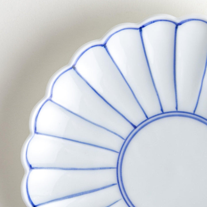 Chrysanthemum salad plates with a striped design, one in blue and the other in red.