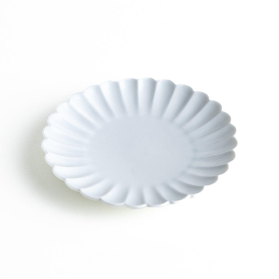Small sauce dish in various colors (white, green, yellow) with scalloped edges.
