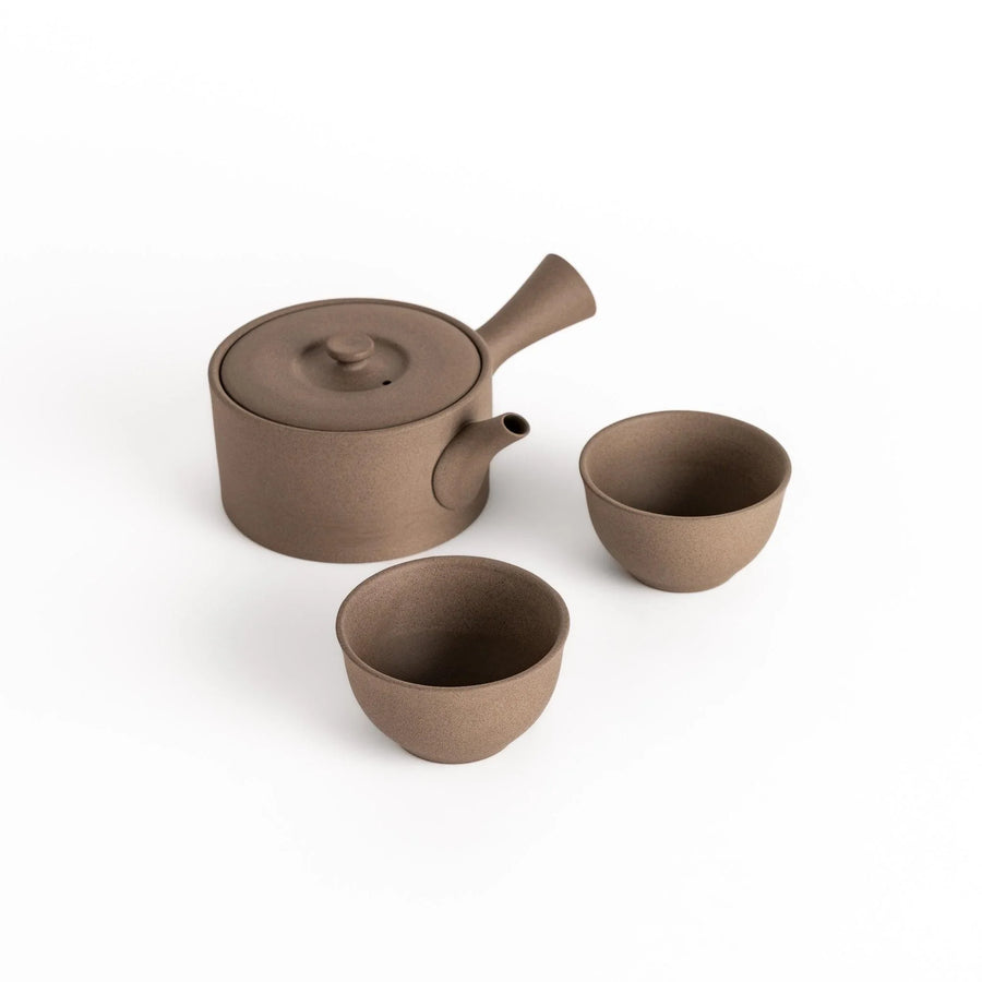 Elegant gray tea set featuring a round teapot with spout and matching bowls, perfect for enjoying your favorite tea in style.