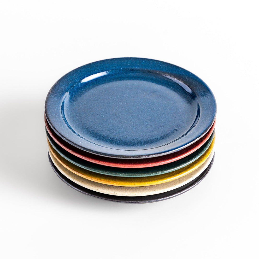 Color Harmony dessert plate featuring glossy multicolor design in blue red green yellow white and black for vibrant dining.