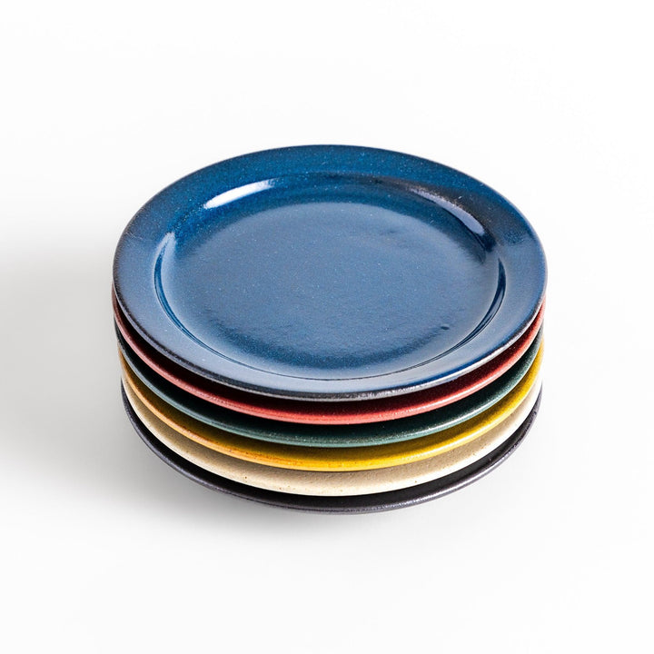 Color Harmony dessert plate featuring glossy multicolor design in blue red green yellow white and black for vibrant dining.