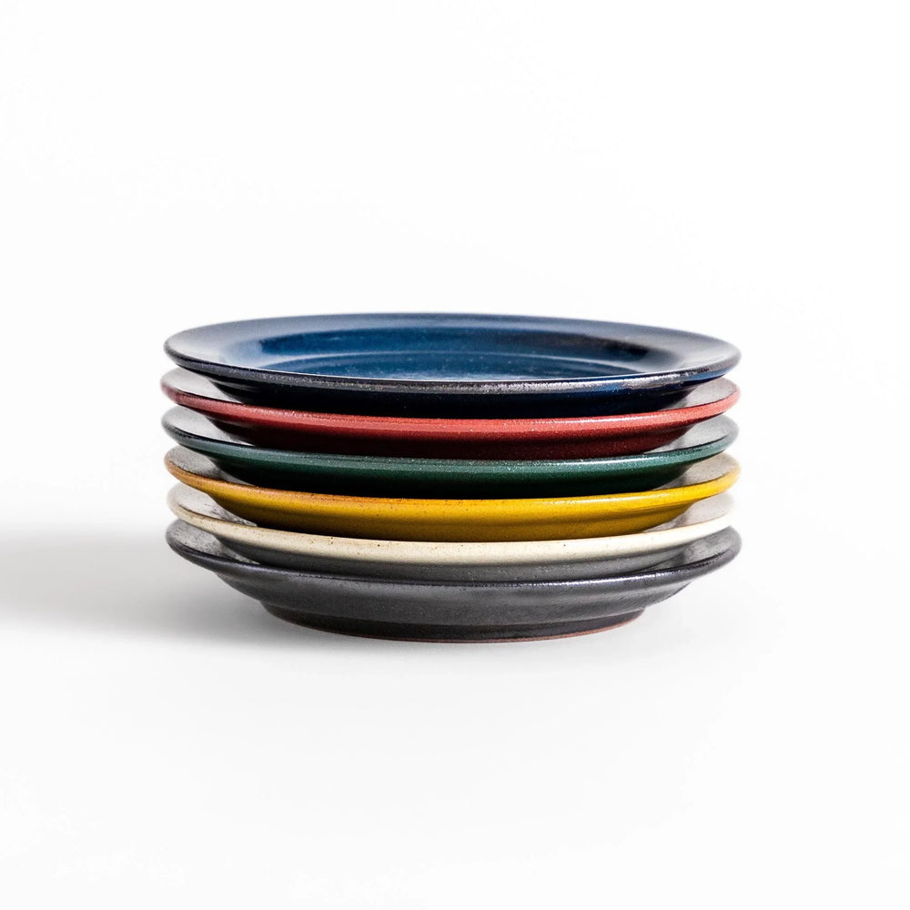 Color Harmony dessert plate featuring glossy multicolor design in blue red green yellow white and black for vibrant dining.