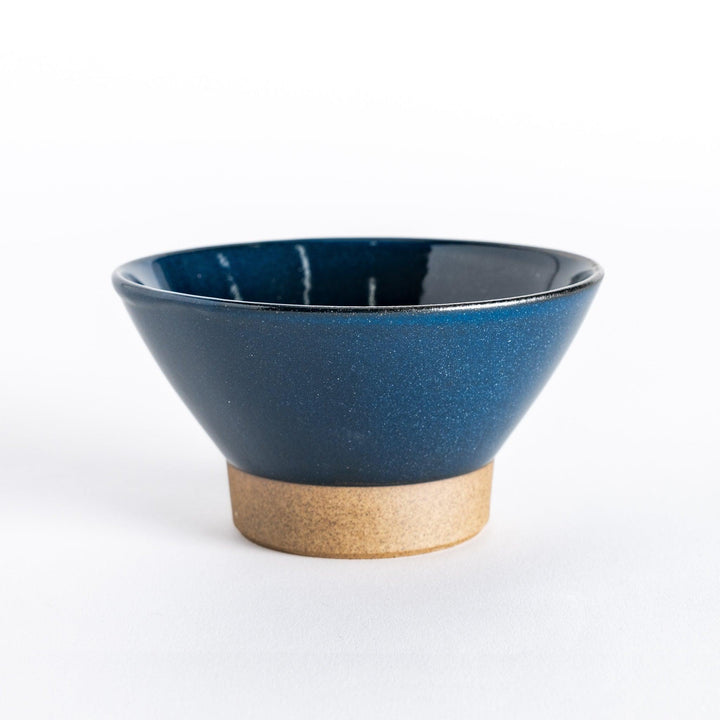 Blue ceramic rice bowl with a glossy finish and neutral-toned base, displayed from the front.