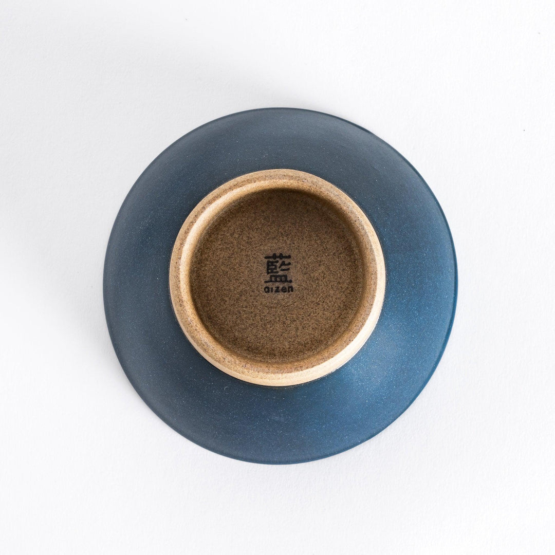 Bottom view of the blue ceramic rice bowl, showing its sturdy neutral-toned base and smooth design.