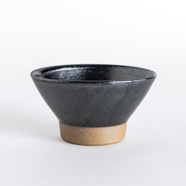 Black ceramic rice bowl with a glossy finish and neutral-toned base, shown from the front.