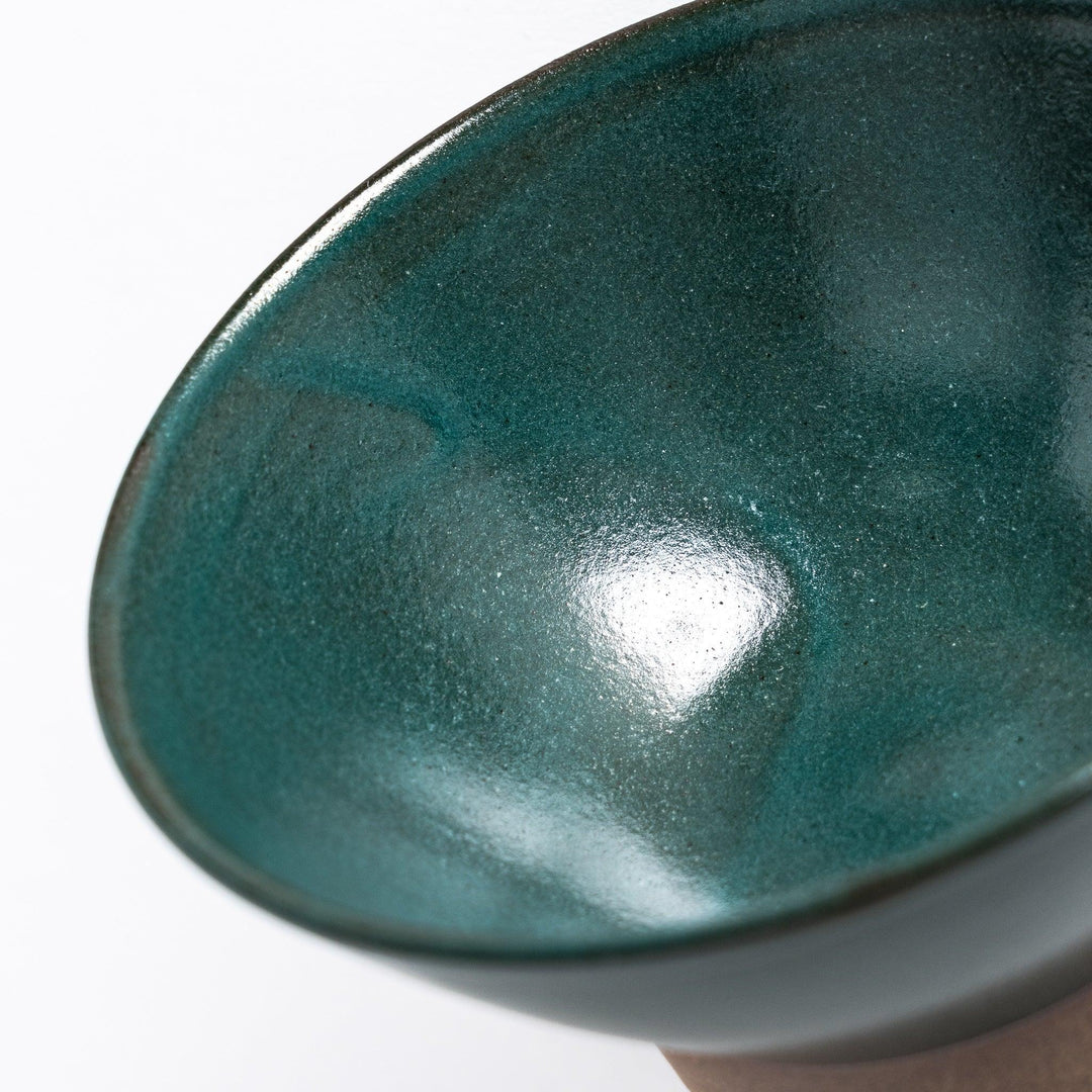 Close-up of the green ceramic rice bowl, emphasizing its glossy green surface and natural-toned base.
