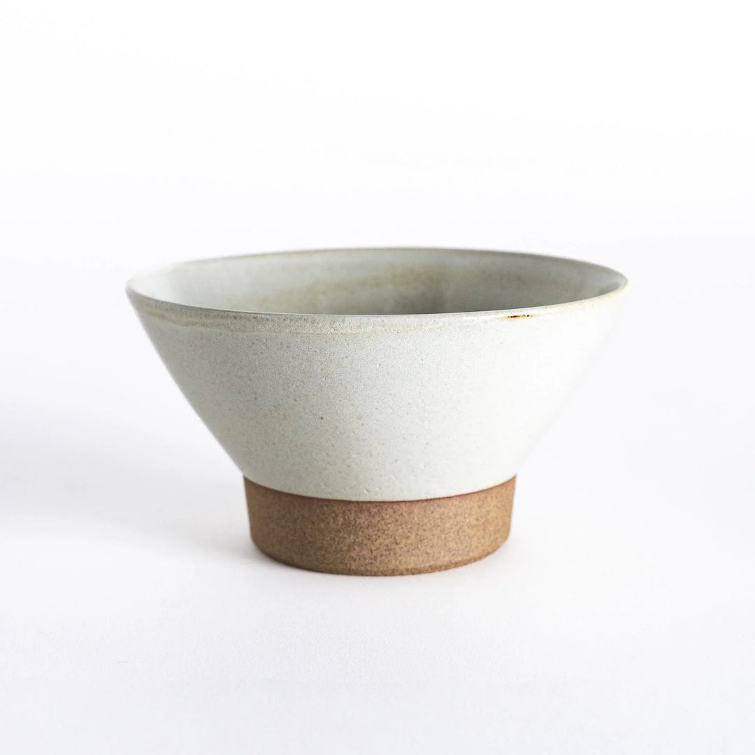White ceramic rice bowl with a matte finish and neutral-toned base, displayed from the front.