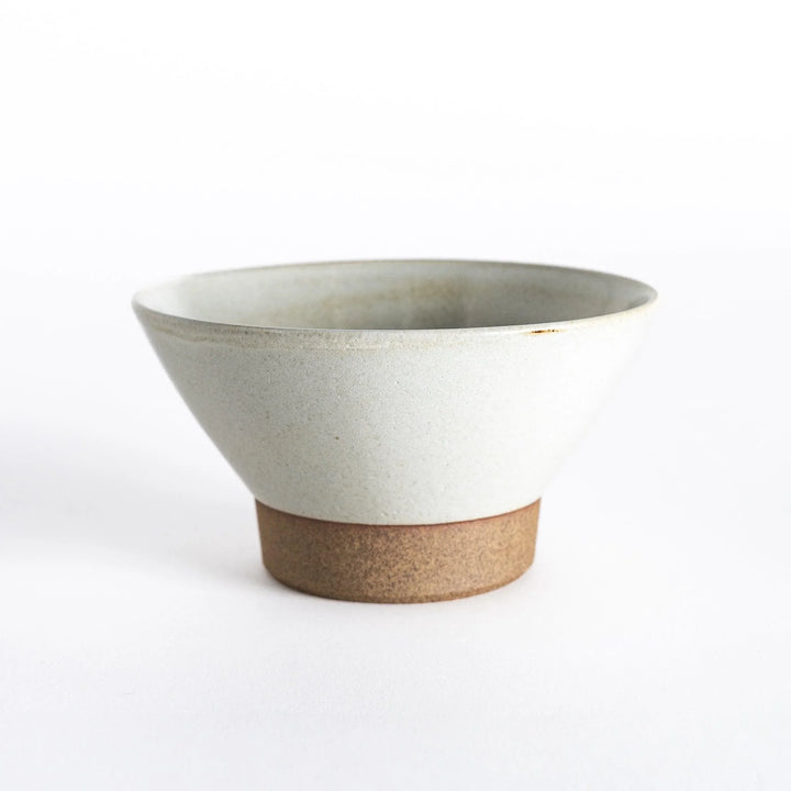 White ceramic rice bowl with a matte finish and neutral-toned base, displayed from the front.