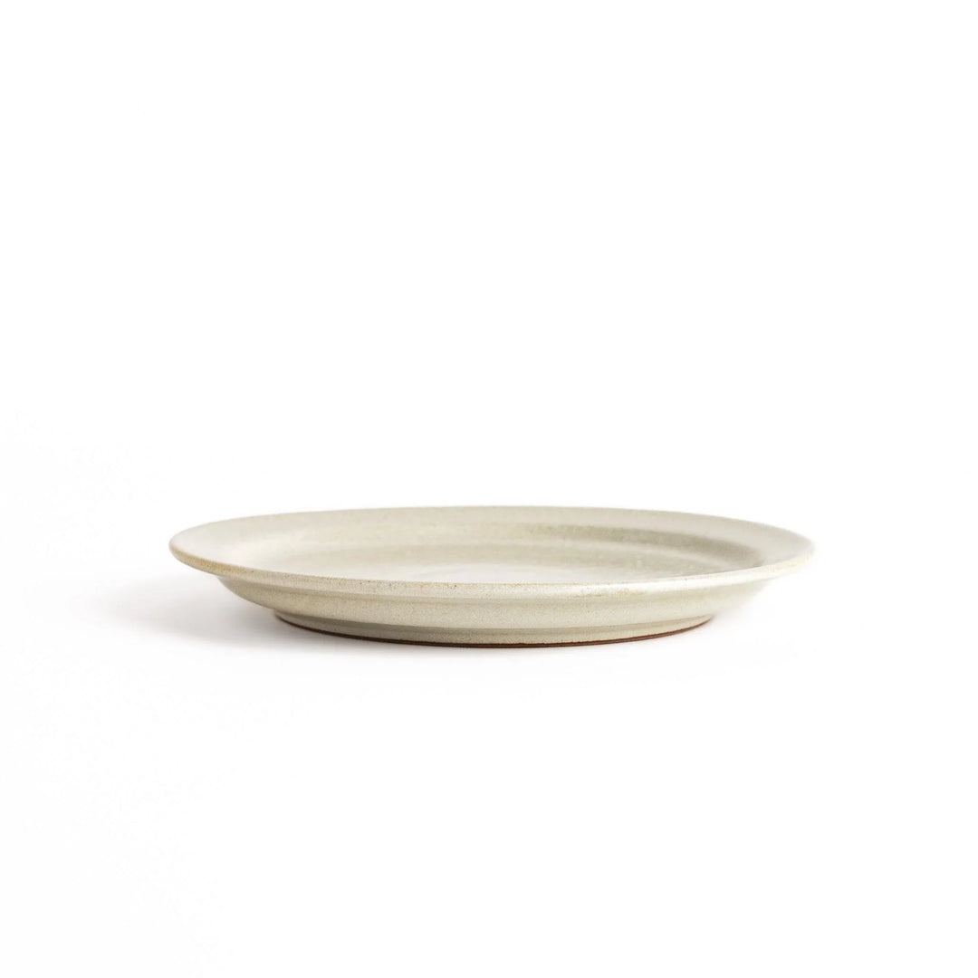 Elegant white salad plate with a smooth matte glaze, perfect for presenting salads or side dishes stylishly.