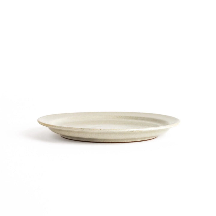 Elegant white salad plate with a smooth matte glaze, perfect for presenting salads or side dishes stylishly.
