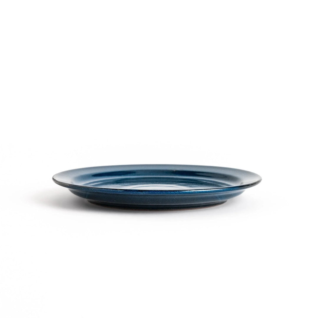 Elegant blue salad plate with a smooth matte glaze, perfect for presenting salads or side dishes stylishly.