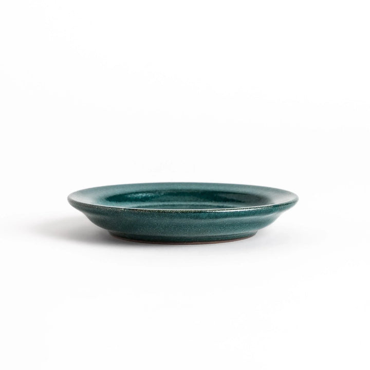 Green ceramic sauce dish with a glossy finish and a minimalist design, ideal for serving dips or condiments elegantly.