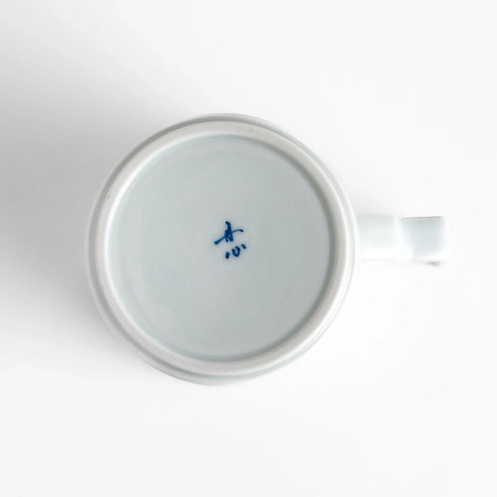 Elegant white ceramic mug with a subtle blue floral pattern, ideal for enjoying your favorite hot beverages.