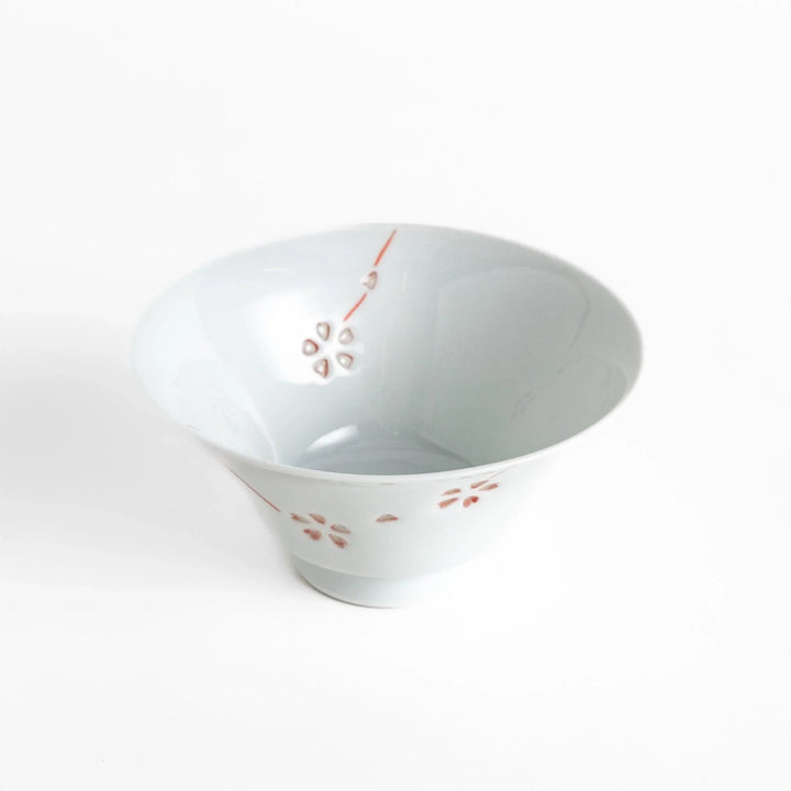 Petal crystal rice bowl with floral designs on white porcelain ideal for serving rice with elegance.