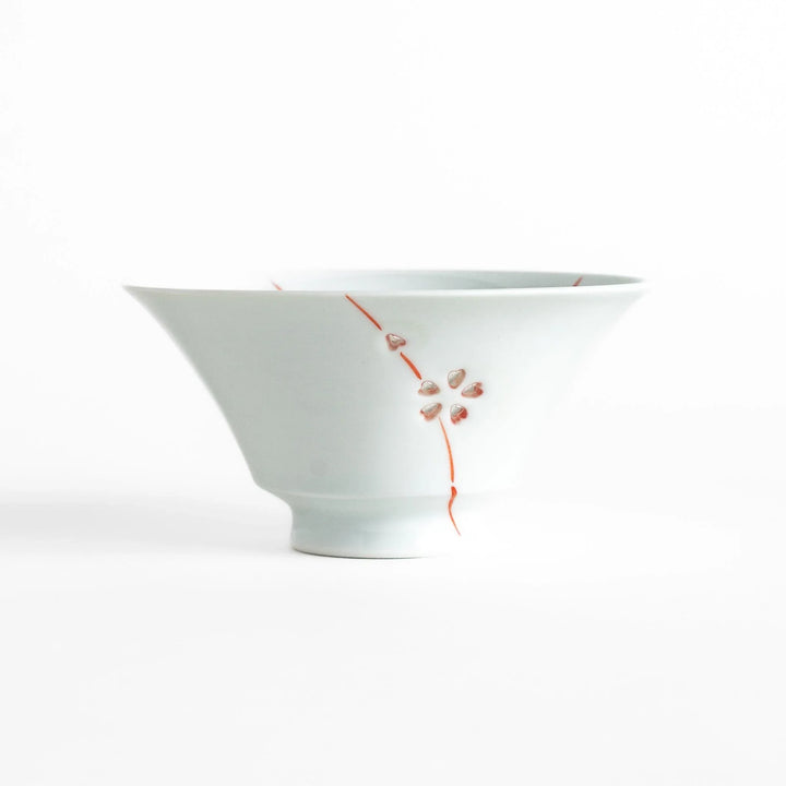 Petal crystal rice bowl with floral designs on white porcelain ideal for serving rice with elegance.