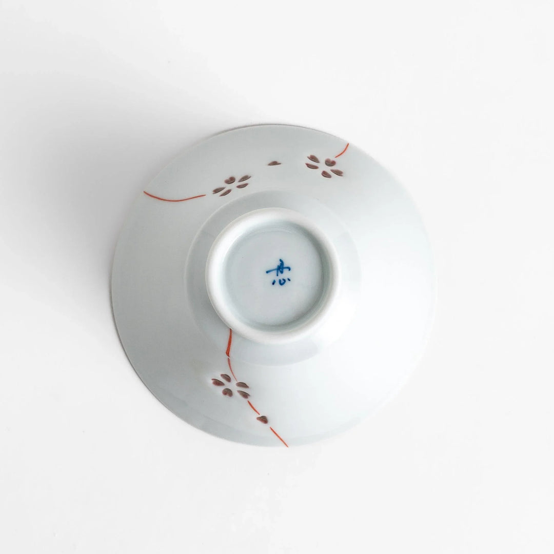 Petal crystal rice bowl with floral designs on white porcelain ideal for serving rice with elegance.