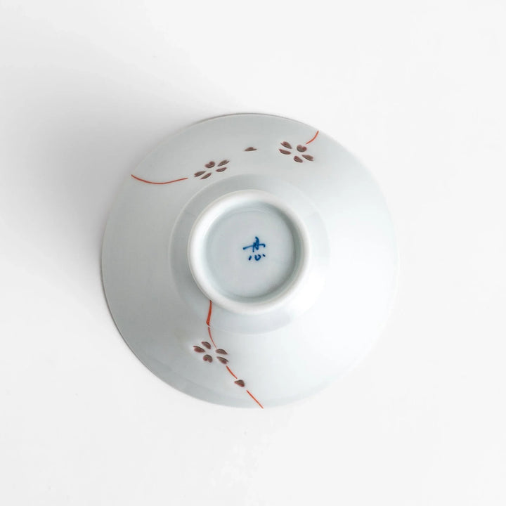 Petal crystal rice bowl with floral designs on white porcelain ideal for serving rice with elegance.