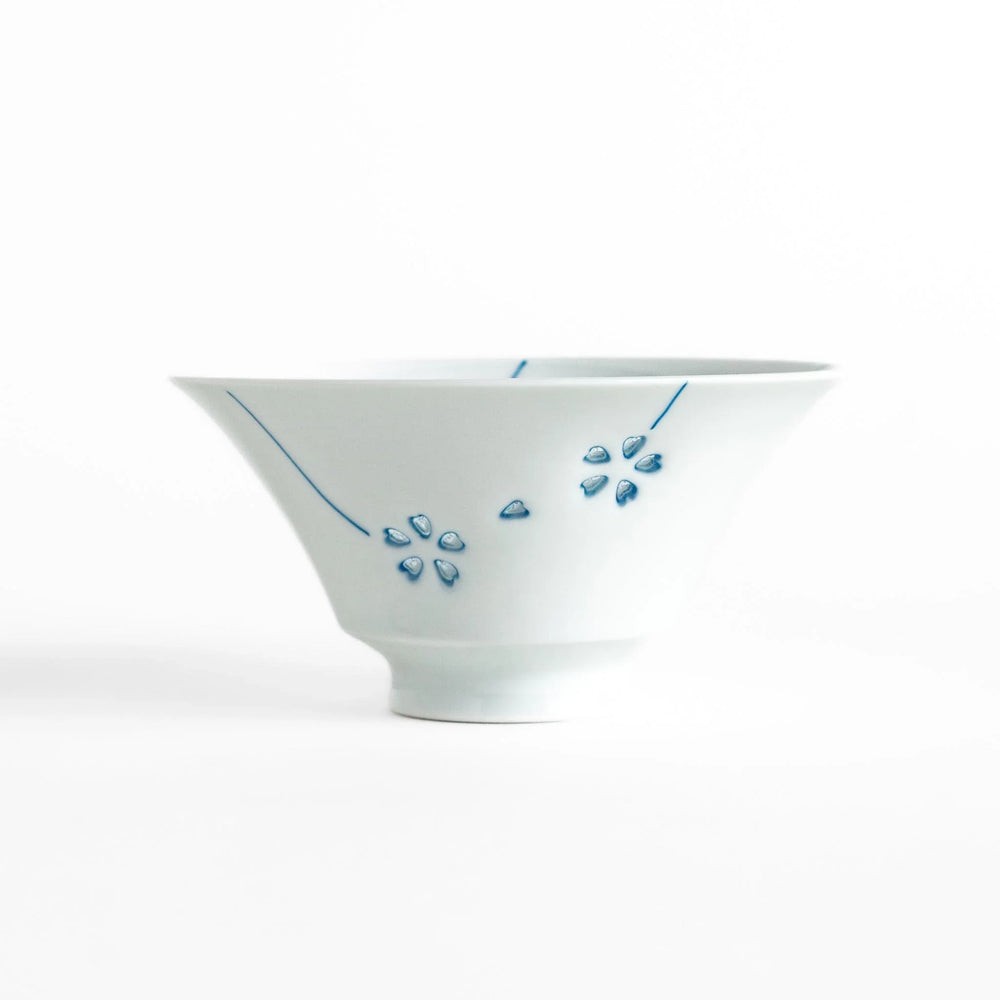 Petal crystal rice bowl with floral designs on white porcelain ideal for serving rice with elegance.