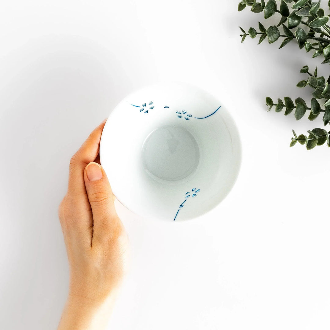 Petal crystal rice bowl with floral designs on white porcelain ideal for serving rice with elegance.