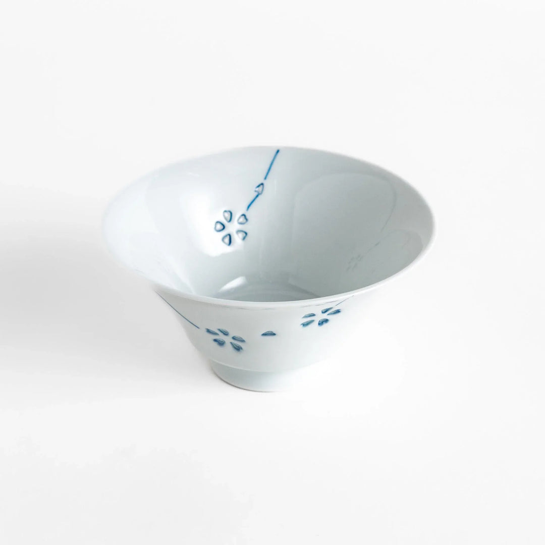 Petal crystal rice bowl with floral designs on white porcelain ideal for serving rice with elegance.