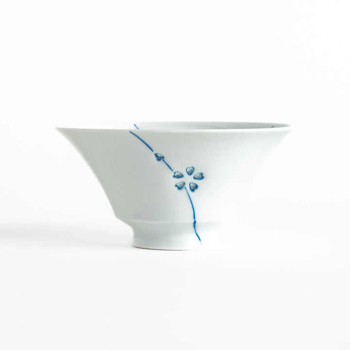 Petal crystal rice bowl with floral designs on white porcelain ideal for serving rice with elegance.