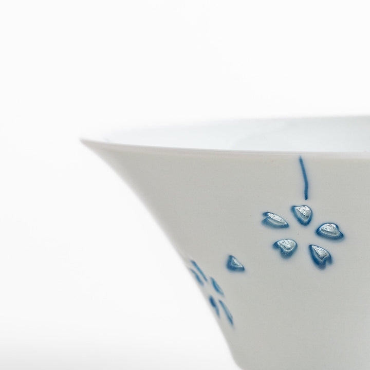 Petal crystal rice bowl with floral designs on white porcelain ideal for serving rice with elegance.