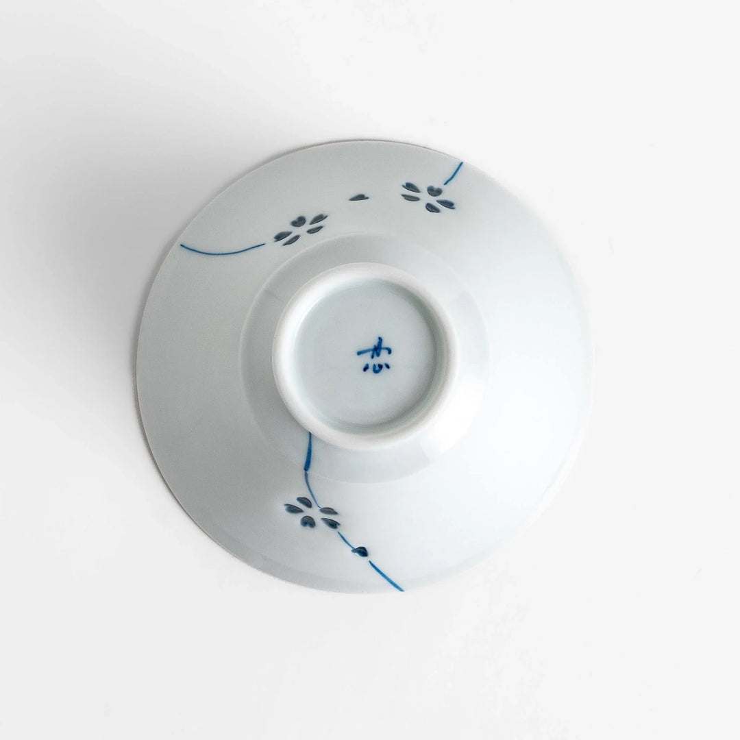 Petal crystal rice bowl with floral designs on white porcelain ideal for serving rice with elegance.