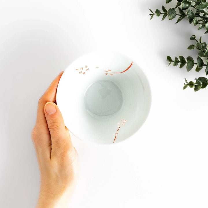 Petal crystal rice bowl with floral designs on white porcelain ideal for serving rice with elegance.